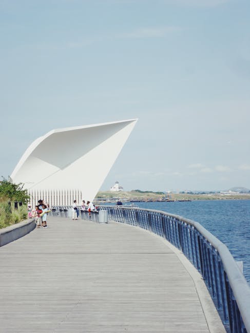 Modern architectural walkway by the sea representing the wellness journey